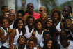 Jamaican Olympic gold medallist Bolt poses with youths at Mangueira slum Olympic center, ahead of the "Mano a Mano" challenge, a 100-meter race which will be held on this Sunday, in Rio de Janeiro