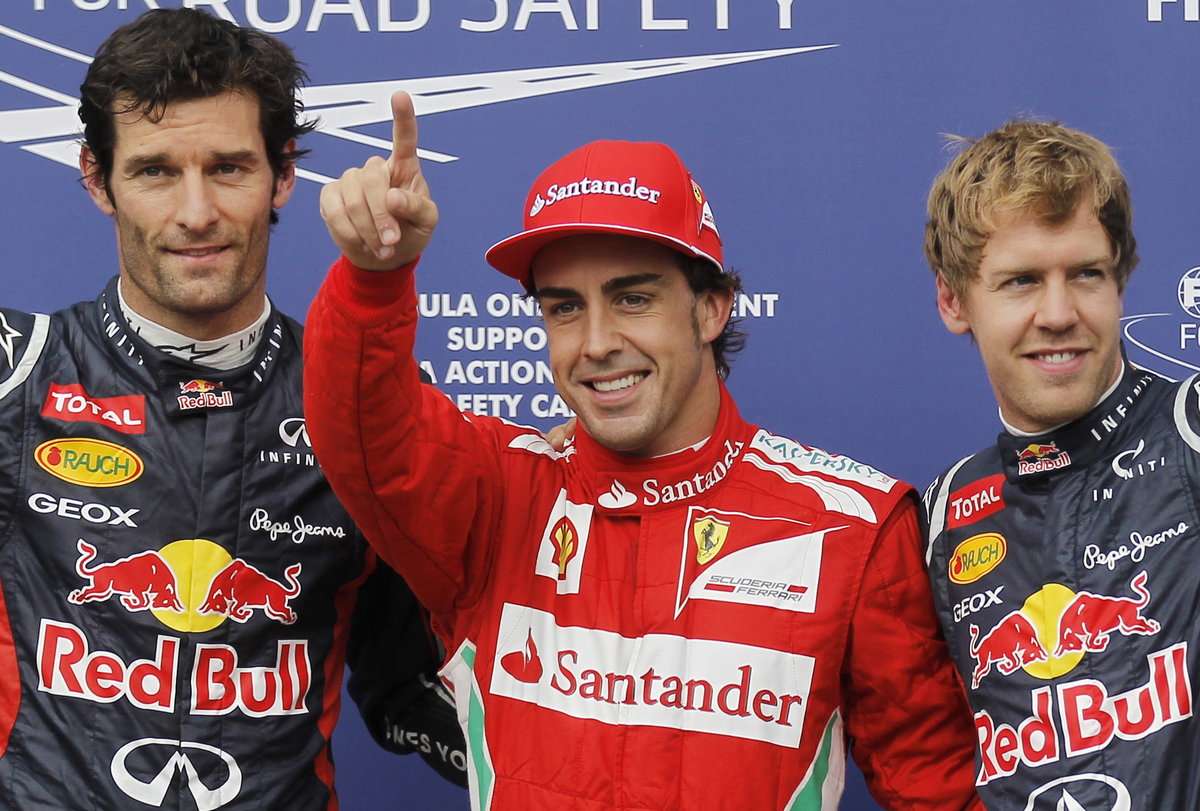 Ferrari Formula One driver Fernando Alonso of Spain celebrates after taking the pole position during the qualifying session at the German F1 Grand Prix at the Hockenheimring in Hockenheim