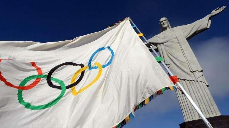 Handout picture released by Rio de Janeiro's governor office showing the Olympic flag at the Christ the Redeemer statue --Rio de Janeiro's