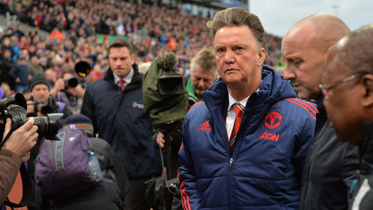 Manchester United's Dutch manager Louis van Gaal (3rd R) leaves after the English Premier League football match between Stoke City and Manchester United at the Britannia Stadium in Stoke-on-Trent, central England on December 26, 2015. Stoke won the game 2