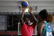 Jamaican Olympic gold medallist Bolt plays basketball with youths at Mangueira slum Olympic center, ahead of the "Mano a Mano" challenge, a 100-meter race which will be held on this Sunday, in Rio de Janeiro
