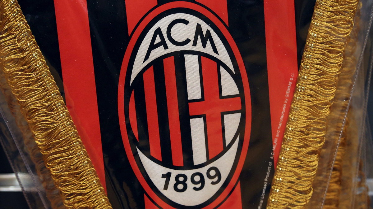 The AC Milan logo is pictured on a pennant in a soccer store in downtown Milan