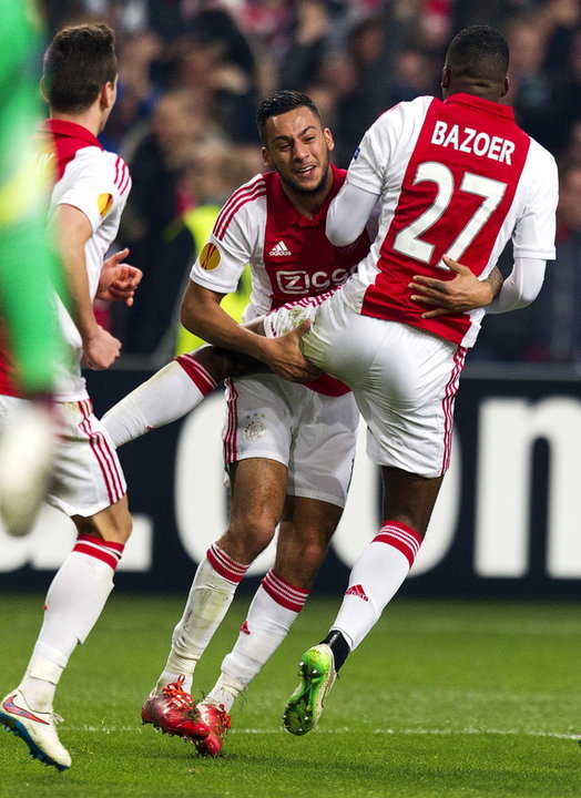 Ajax Amsterdam's Bazoer celebrates his goal with his teammate Kishna during their Europa League soccer match against Dnipro Dnipropetrovsk in Amsterdam