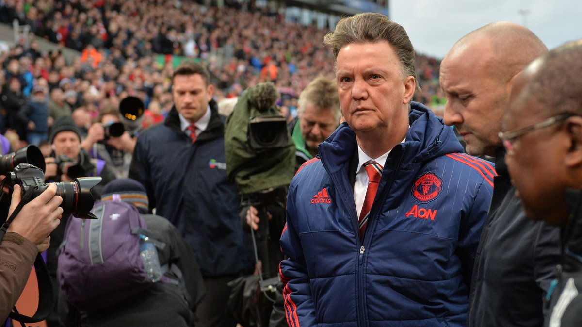 Manchester United's Dutch manager Louis van Gaal (3rd R) leaves after the English Premier League football match between Stoke City and Manchester United at the Britannia Stadium in Stoke-on-Trent, central England on December 26, 2015. Stoke won the game 2