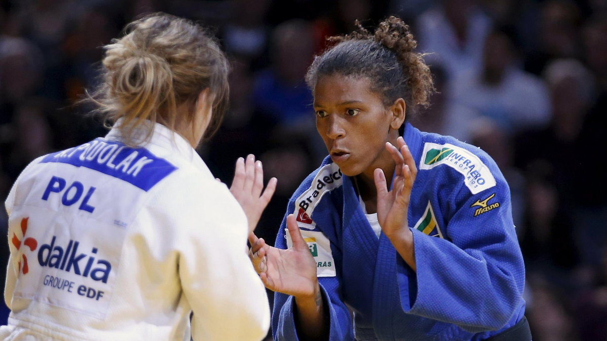 Rafaela Silva of Brazil fights with Poland's Arleta Podolak in their women's under 57kg bronze medal match at the Paris International Grand Slam judo tournament