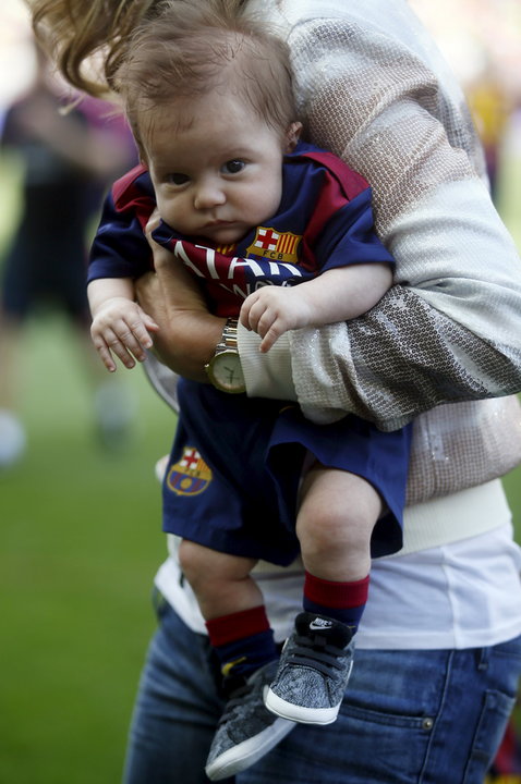 The second son of Shakira and Gerard Pique, Sasha, is held by Gerard Pique's mother, Montse, before the Spanish first division soccer match between Barcelona and Valencia at Camp Nou stadium in Barcelona