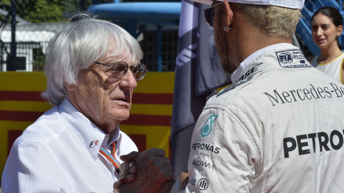 Bernie Ecclestone (L)