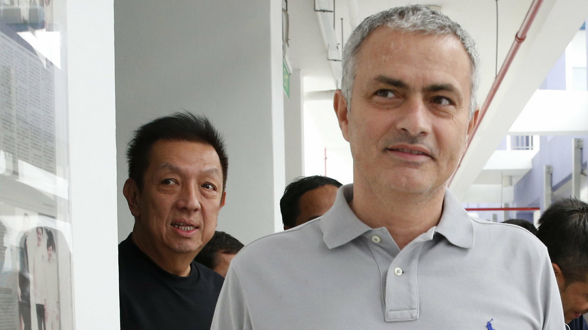 Former Chelsea manager Jose Mourinho arrives with Valencia owner Peter Lim to speak with students of NorthLight School in Singapore