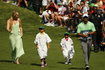 U.S. golferTiger Woods walks down the fairway with his children Sam and Charlie and his girfriend Vonn during the par 3 event held ahead of the 2015 Masters at Augusta National Golf Course in Augusta