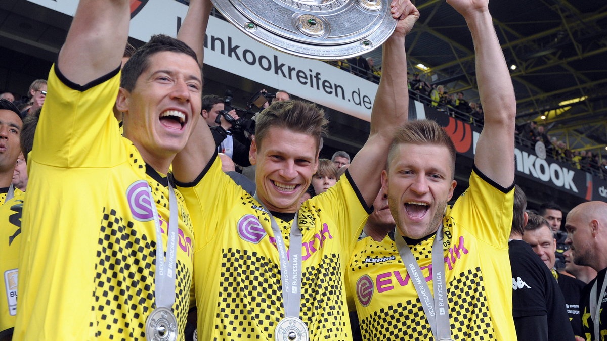 Robert Lewandowski, Łukasz Piszczek i Jakub Błaszczykowski świętują mistrzostwo Niemiec (5 maja 2012)