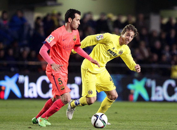 Sergio Busquets (L)