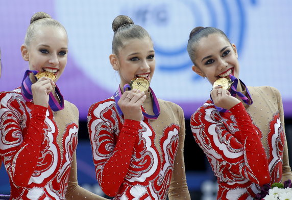 Russia's Kudryavtseva, Soldatova and Mamun pose with gold medals for a photo at the 31st European Rhythmic Gymnastics Championships in Minsk