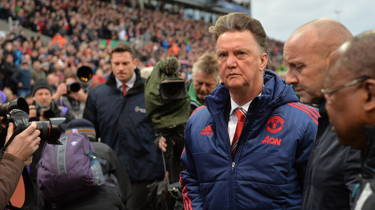 Manchester United's Dutch manager Louis van Gaal (3rd R) leaves after the English Premier League football match between Stoke City and Manchester United at the Britannia Stadium in Stoke-on-Trent, central England on December 26, 2015. Stoke won the game 2