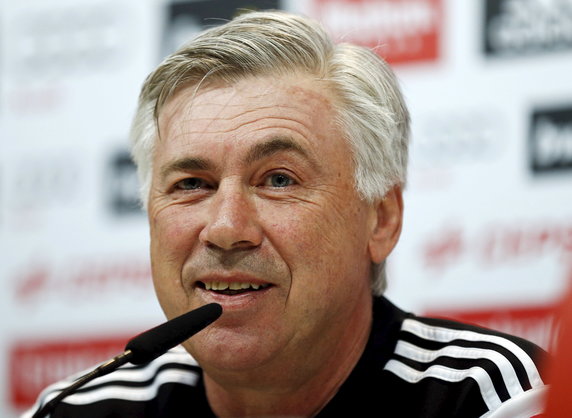 Real Madrid's coach Carlo Ancelotti smiles during a news conference at their training grounds outside Madrid