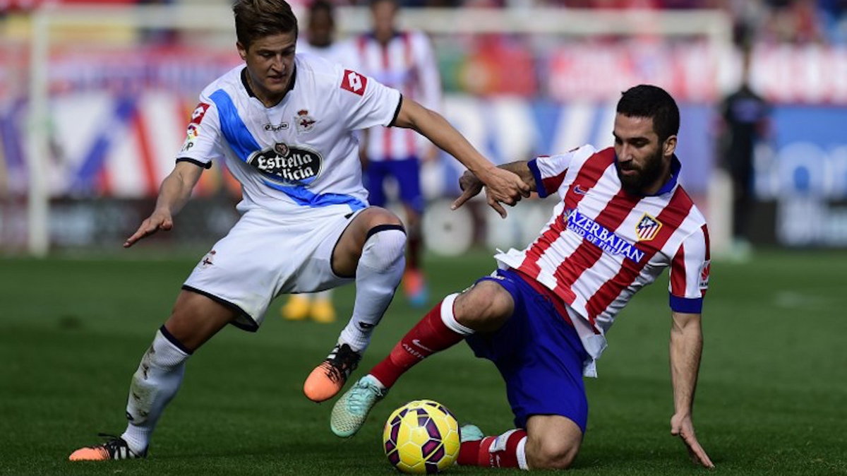 Cezary Wilk w czasie meczu z Atletico Madryt, fot. PIERRE-PHILIPPE MARCOU / AFP