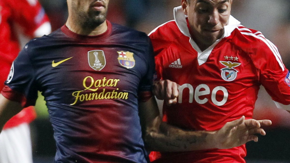 Sergio Busquets (L)