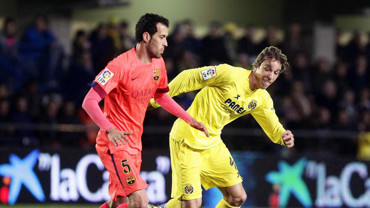 Sergio Busquets (L)