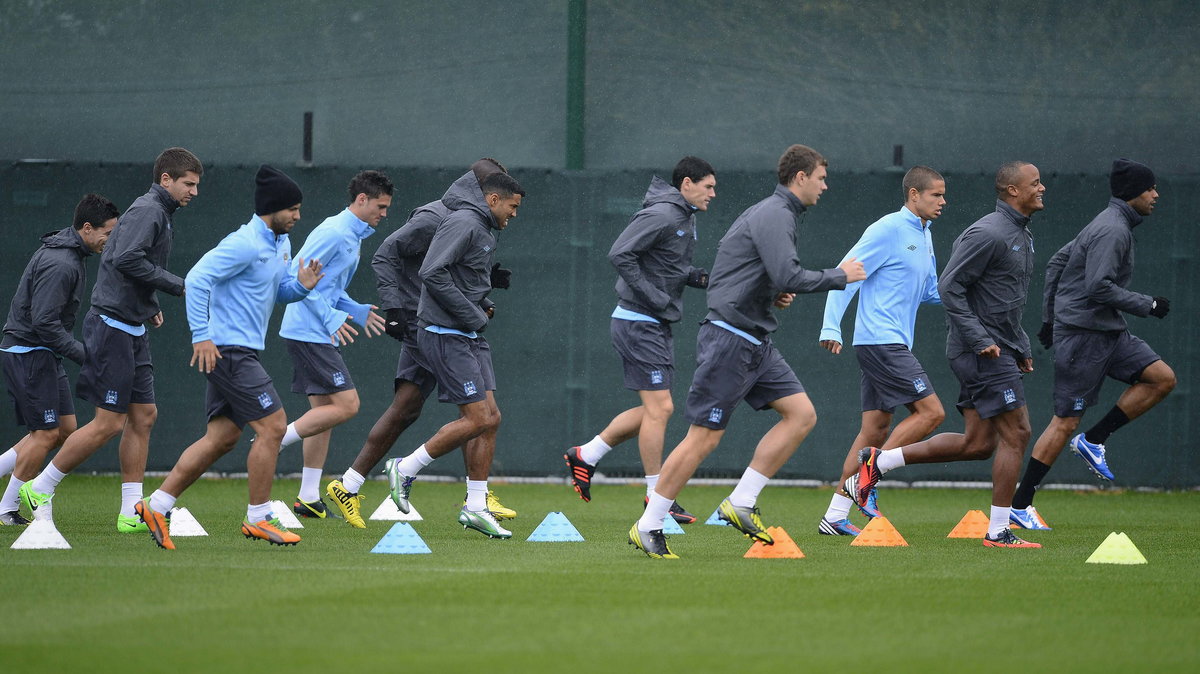 Manchester City's players run during a practice session at the club's Carrington training complex in Manchester