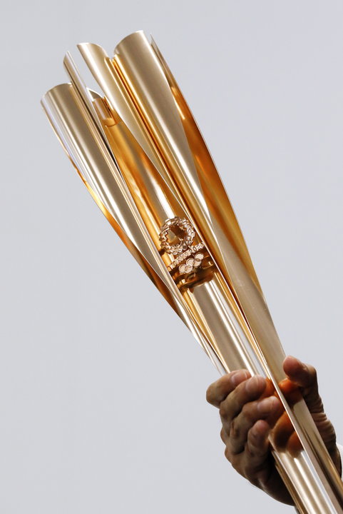 epa07449790 - JAPAN OLYMPICS TOKYO TORCH (Tokyo 2020 Olympic Torch and emblem unveiled during press event in Tokyo)