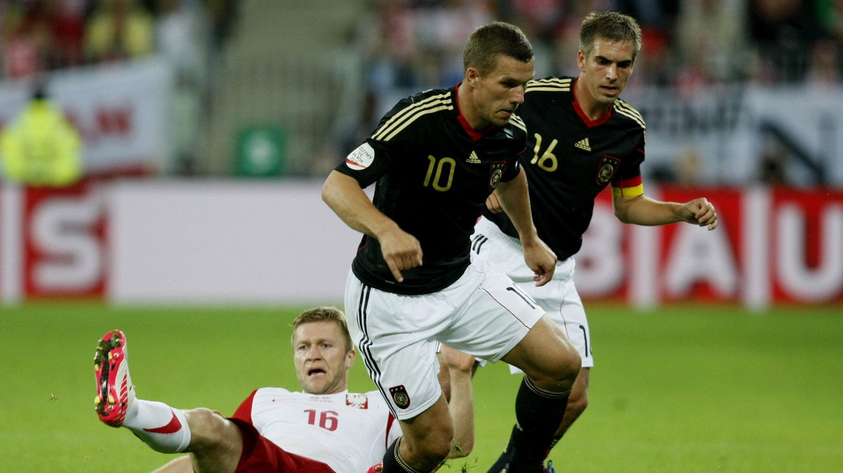 Lukas Podolski (C) i Philipp Lahm (P)