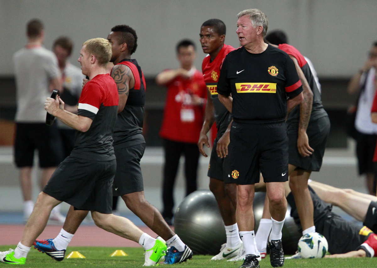 Manchester United's coach Alex Ferguson attends a training session at the Shanghai Stadium
