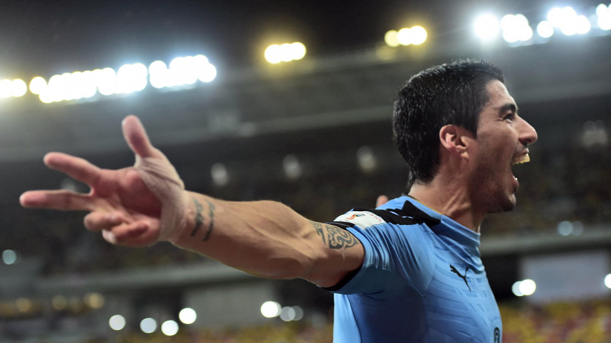 Uruguay's Luis Suarez celebrates after scoring against Brazil during their Russia 2018 FIFA World Cup South American Qualifiers' football match, in Recife, northeastern Brazil, on March 25, 2016. AFP PHOTO / CHRISTOPHE SIMON / AFP / CHRISTOPHE SIMON