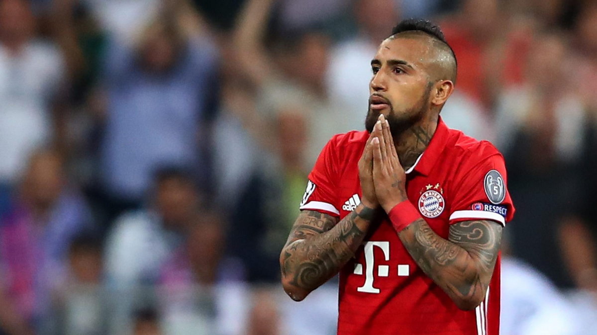 Bayern Munich's Arturo Vidal looks dejected after being sent off