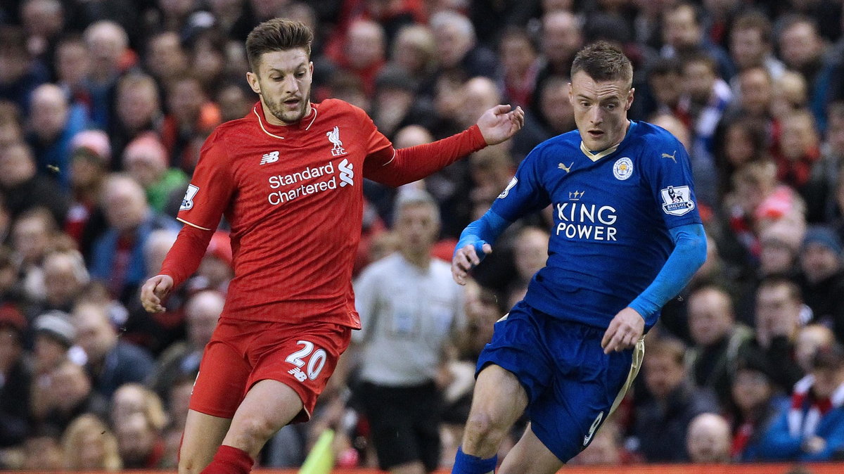 Leicester City's English striker Jamie Vardy (R) vies with Liverpool's English midfielder Adam Lallana (L) during the English Premier League football match between Liverpool and Leicester City at the Anfield stadium in Liverpool, north-west England on Dec