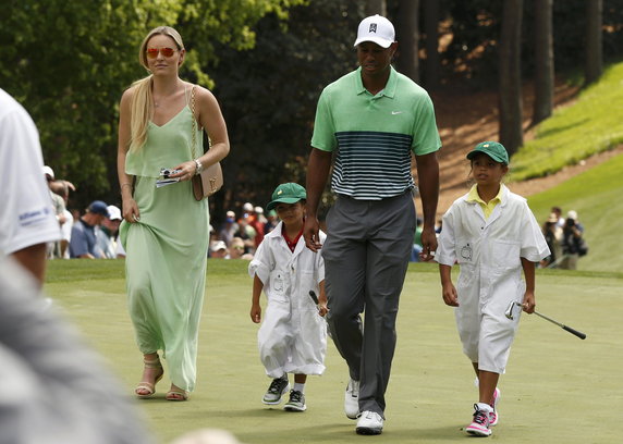 Vonn walks with U.S. golfer Woods and his children Sam and Charlie during the par 3 event held ahead of the 2015 Masters at Augusta National Golf Course in Augusta