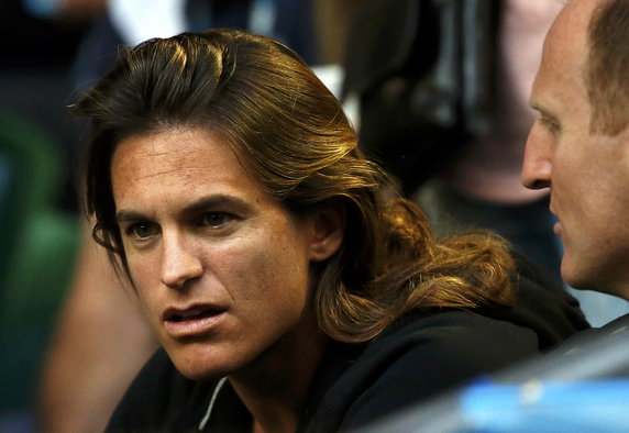 Mauresmo, coach of Britain's Murray, watches his semi-final match against Canada's Raonic at the Australian Open tennis tournament at Melbourne Park