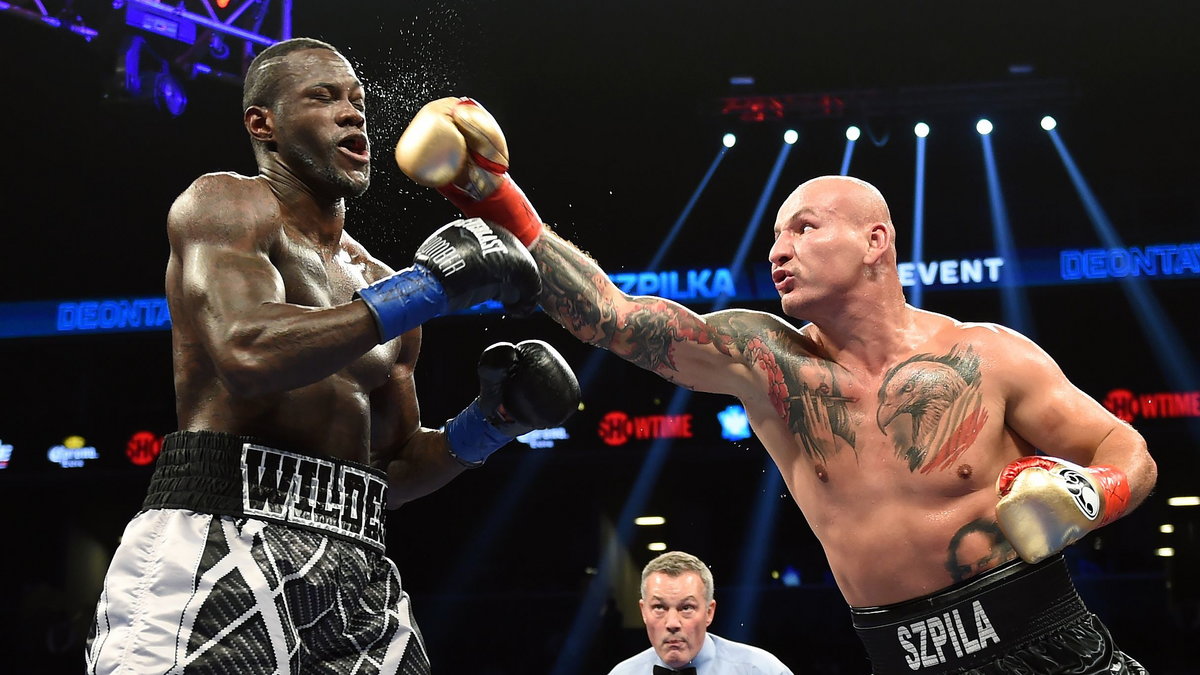 Deontay Wilder (L)