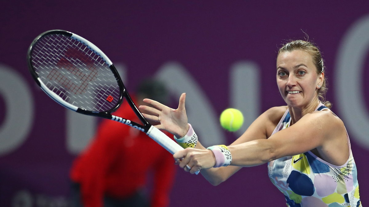 FILE PHOTO: Czech Republic's Petra Kvitova poses with the trophy after blitzing Russia's Svetlana Ku