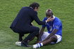 Italy's coach Prandelli comforts Balotelli after the game against Spain at the Euro 2012 final soccer match at the Olympic Stadium in Kiev