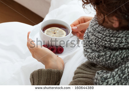 stock-photo-sick-woman-drinking-hot-tea-with-lemon-and-raspberries-160644389.jpg