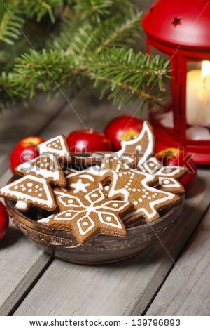 stock-photo-bowl-of-gingerbread-cookies-on-rustic-grey-wooden-table-under-green-fir-branch-copy-space-139796893.jpg