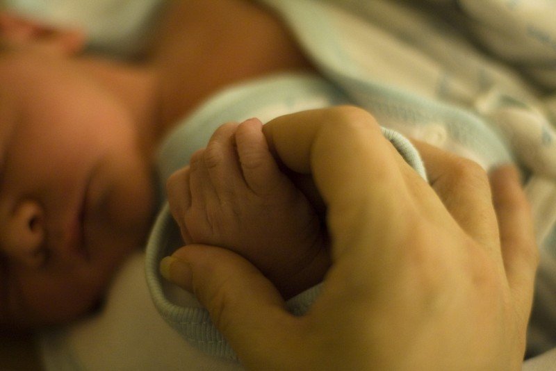 holding-hands-with-a-newborn-baby.jpg